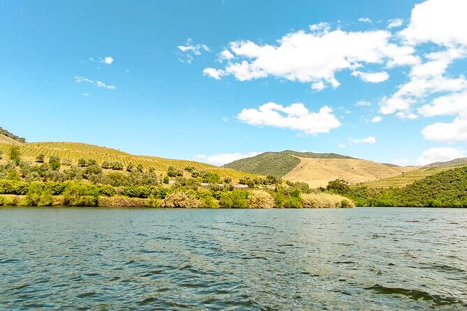Douro | Roots & History - Tour with a local - A calm Rabelo boat on the Douro River you can’t drive to