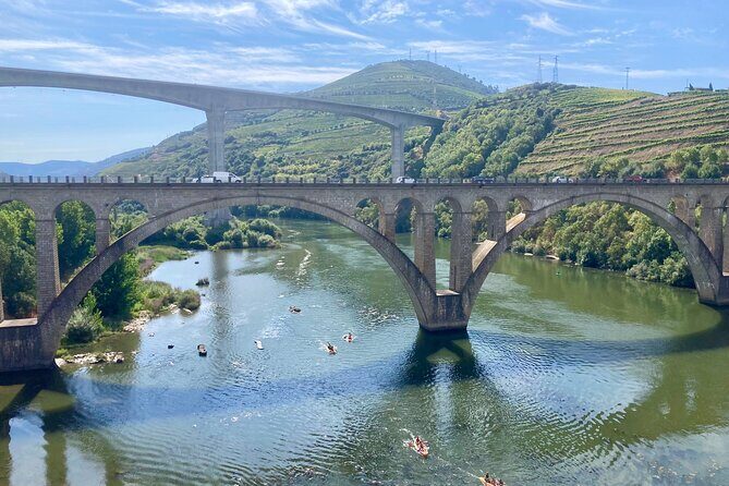 Porto: Private Douro Valley All Inclusive: Tastings, Lunch & Boat - Pinhão small-boat cruise: the riverfront from the water